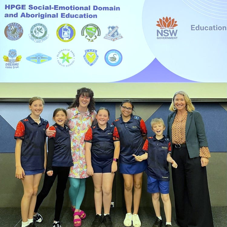 Principal and APCI with students for HPGE conference