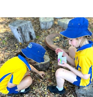 2 girls working in garden