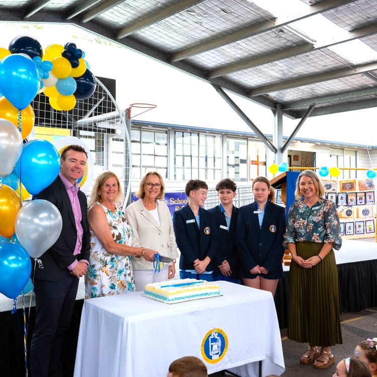 The Mayor and principals cutting the cake for 125 year anniversary with school leaders