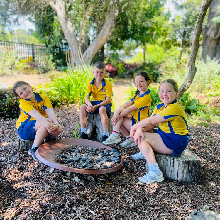 Students sitting in the sensory garden