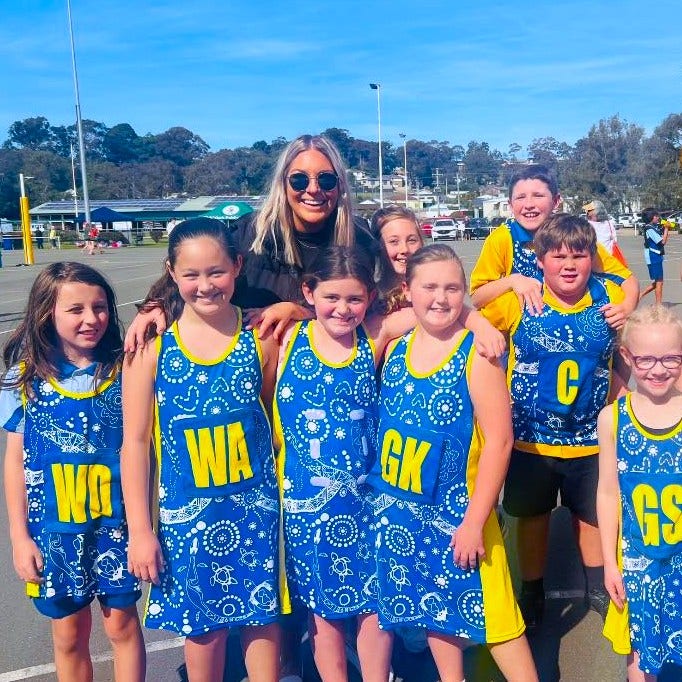 Mixed netball team and teacher/coach