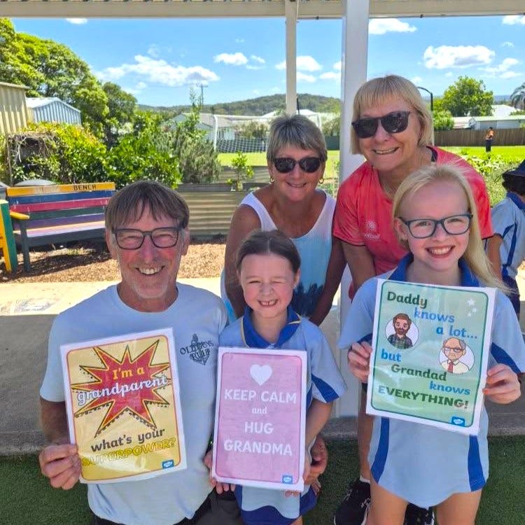Two girls and their grandparents at Grandparents Day